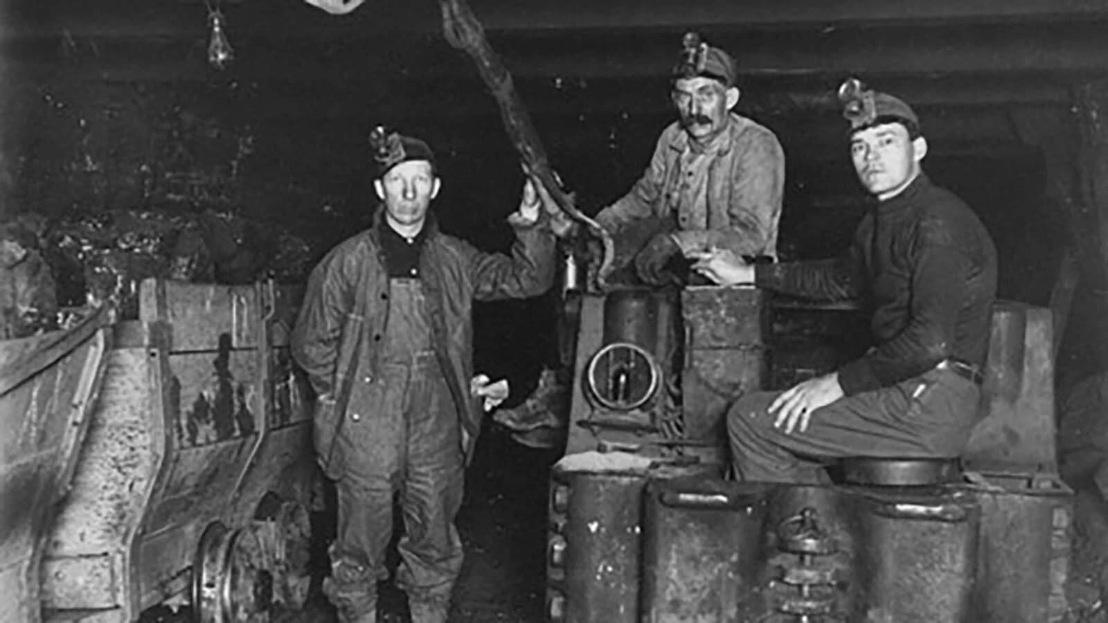 Miners with an electric engine in Dietz No. 8 mine.