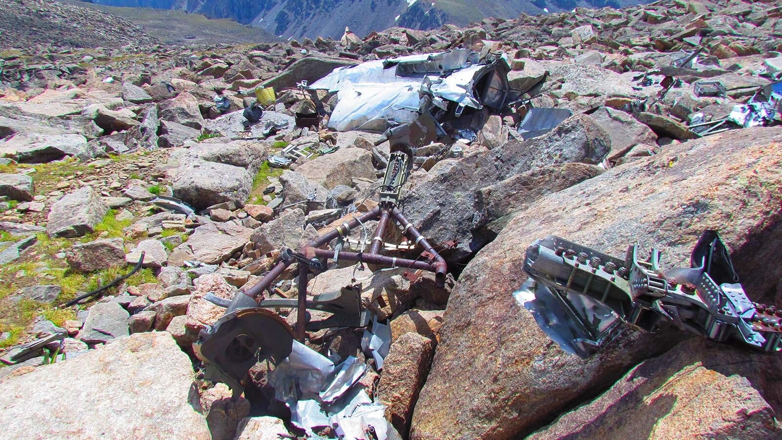 On Aug. 9, 2014, Sylvia Bruner and her husband hiked to the Bomber Mountain site for the first time. The top of the ridge with a large piece of the wreckage visible. The rusty framework in the foreground is a part of the ball turret mount.