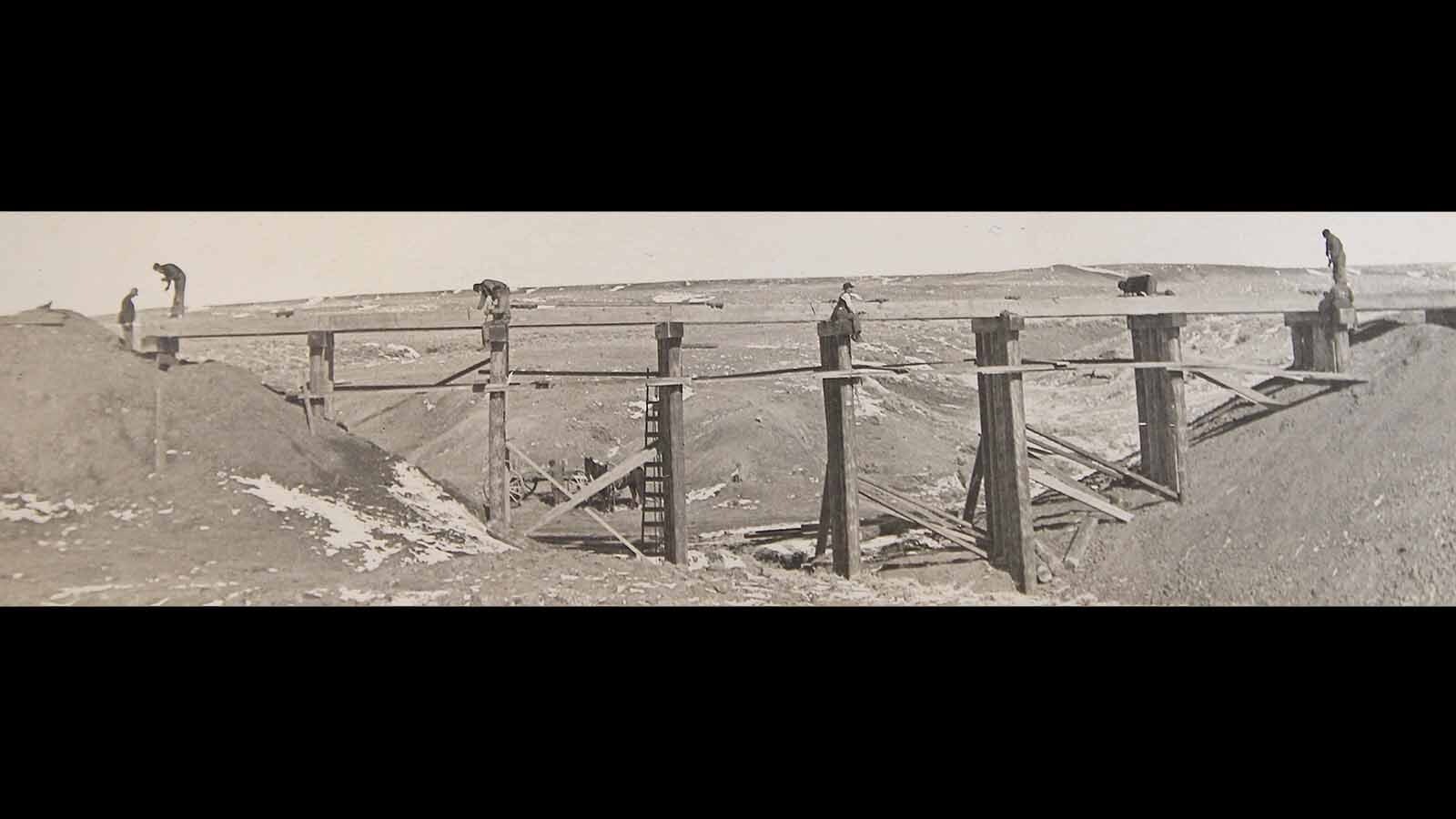A pile bridge near Wolton, WY, in 1906, on the Chicago & North Western line. The bridge is typical construction of pile bridges during the time period.