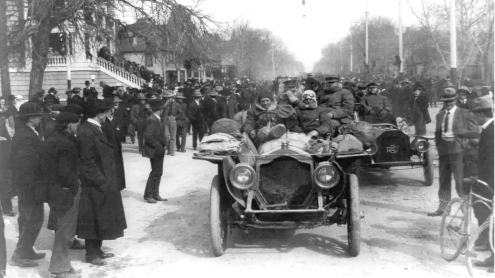 In March 1908, the Thomas Flyer was the first car in the New York to Paris auto race to arrive at the frontier town of Cheyenne, Wyoming. They were greeted with much fanfare and teased about their sheep herder coats which were not typical automobilists attire. The three-man team were escorted into the city and then headed straight for bed.