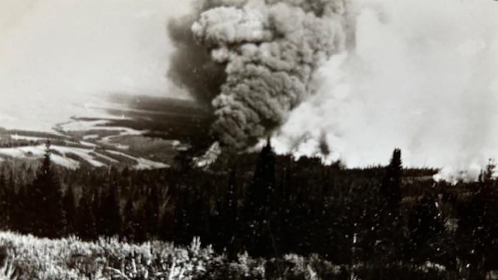 Forest fire in what is now the Bridger-Teton National Forest. Until at least the 1950s, high school kids were taken out of school to assist with hauling and assembling equipment to assist in firefighting.