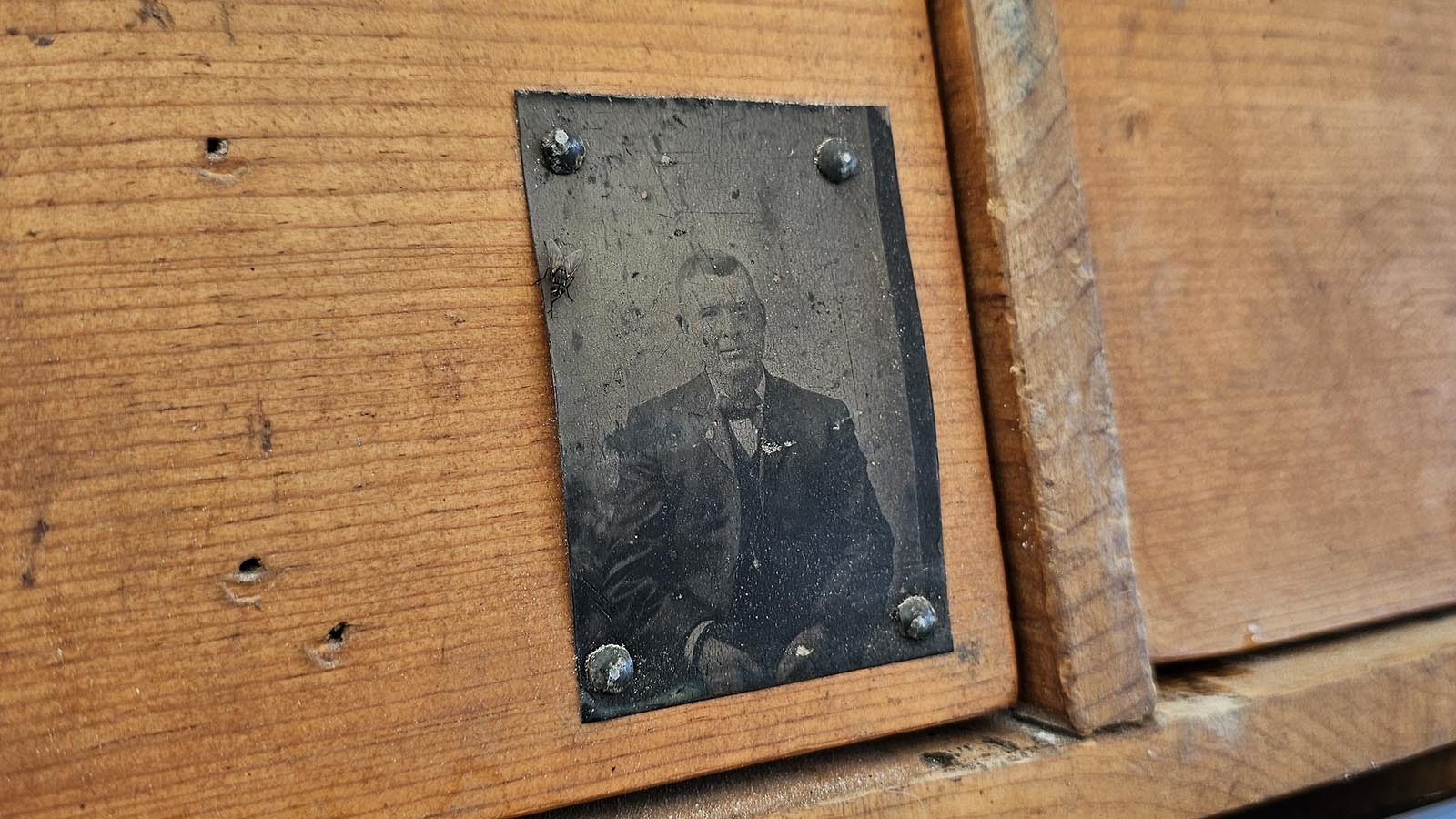 The old tintype photo on the 2 Mules Chuckwagon is likely of the chuckwagon's original cook.