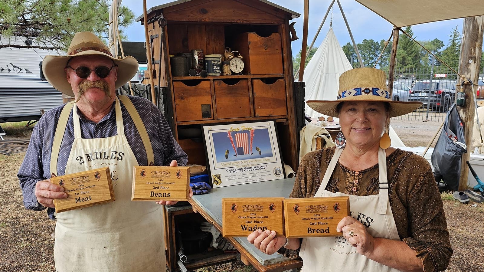 Rich and Deb Herman pose with the plaques they won during the recent Cheyenne Frontier Days cookout. The by-invitation-only event features some of the best chuckwagons in the nation.