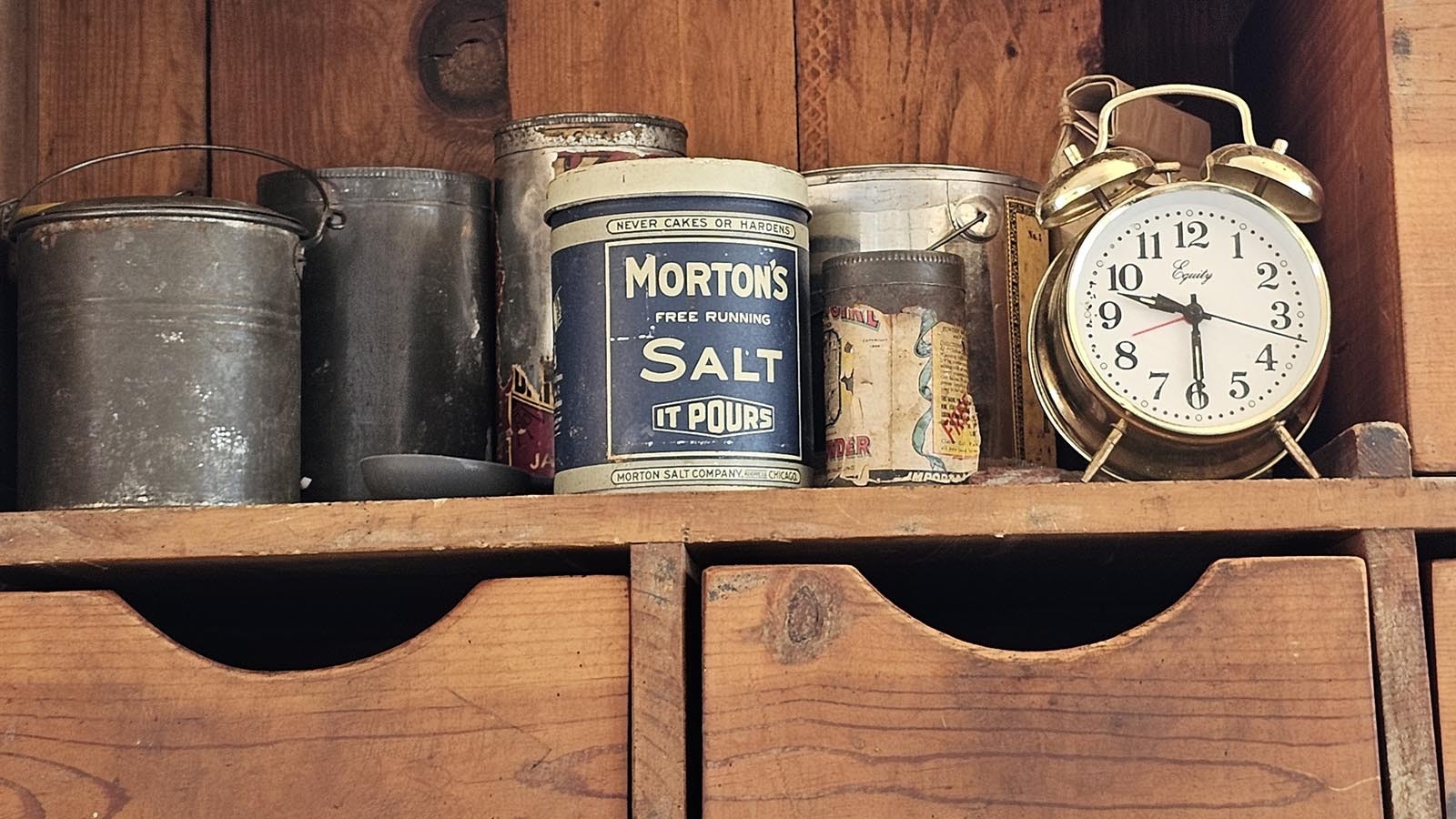 An old-fashioned clock and other cooking artifacts are part of the 2 Mules Chuckwagon.