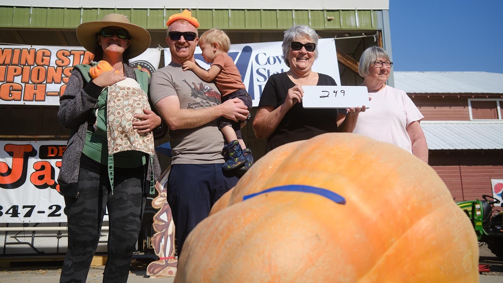 Competitor Christina Camilleri celebrates her 249-pound pumpkin named Alice. Camilleri attended with her family members W.J., Laura, Fyn and Freya Woods, as well as Bibi Camilleri at the 2024 Wyoming State Pumpkin Weigh-Off on Oct. 5, 2024.