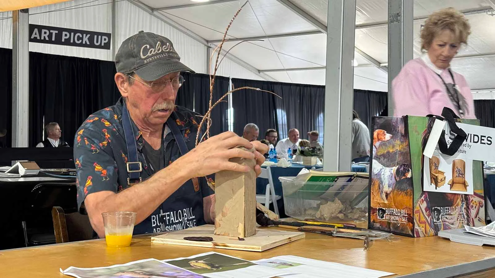 Sculptor Stefan Savides works on the clay sculpture for "Branch Manager," a soon-to-be bronze piece during the 45th Buffalo Bill Art Show and Sale's Quick Draw.