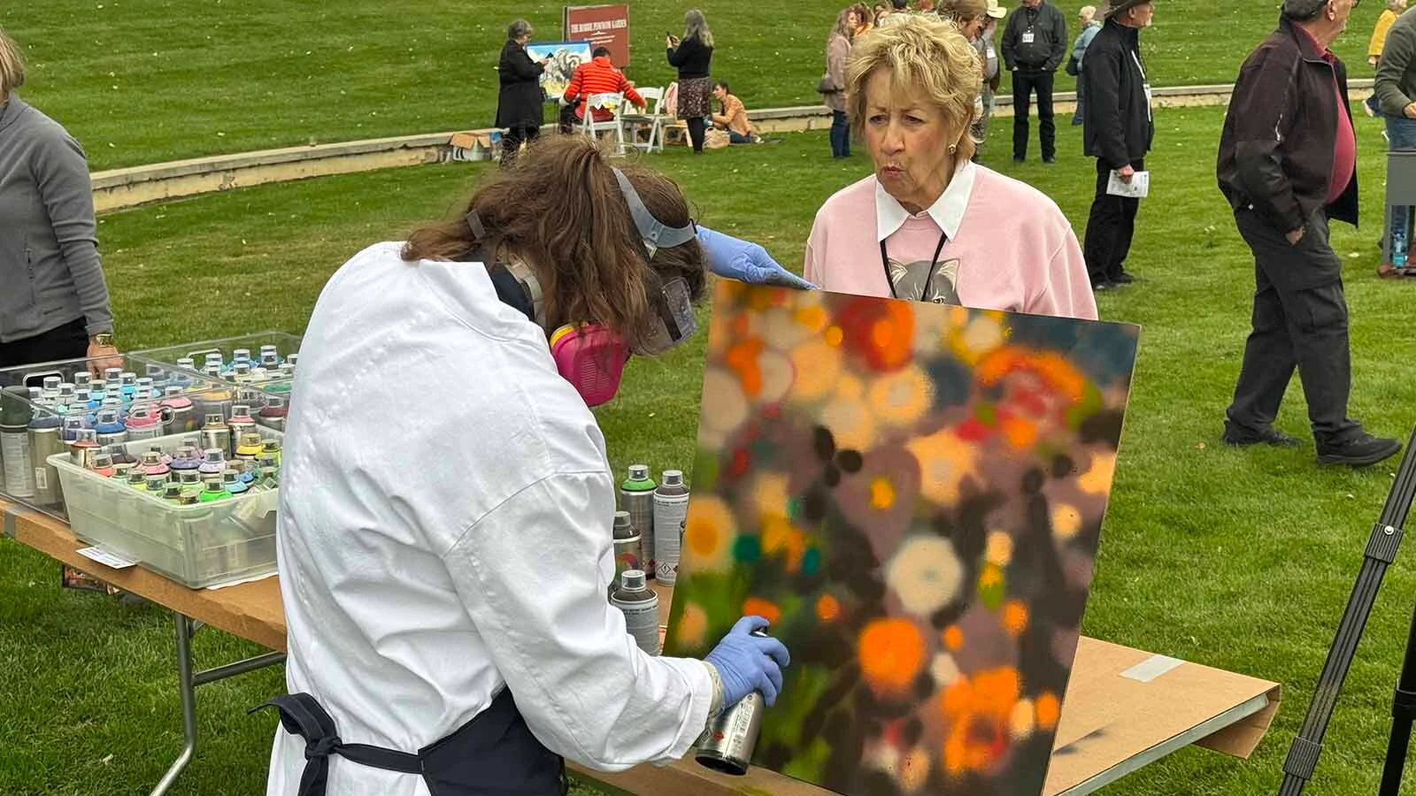 Artist Janell James uses spray paint for her contribution to the 45th Buffalo Bill Art Show and Sale's Quick Draw on Saturday.