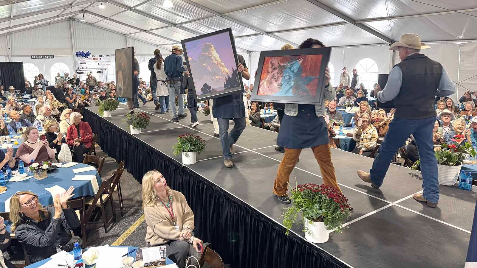 Artists make their way down the runway during the 45th Buffalo Bill Art Show and Sale's Quick Draw.