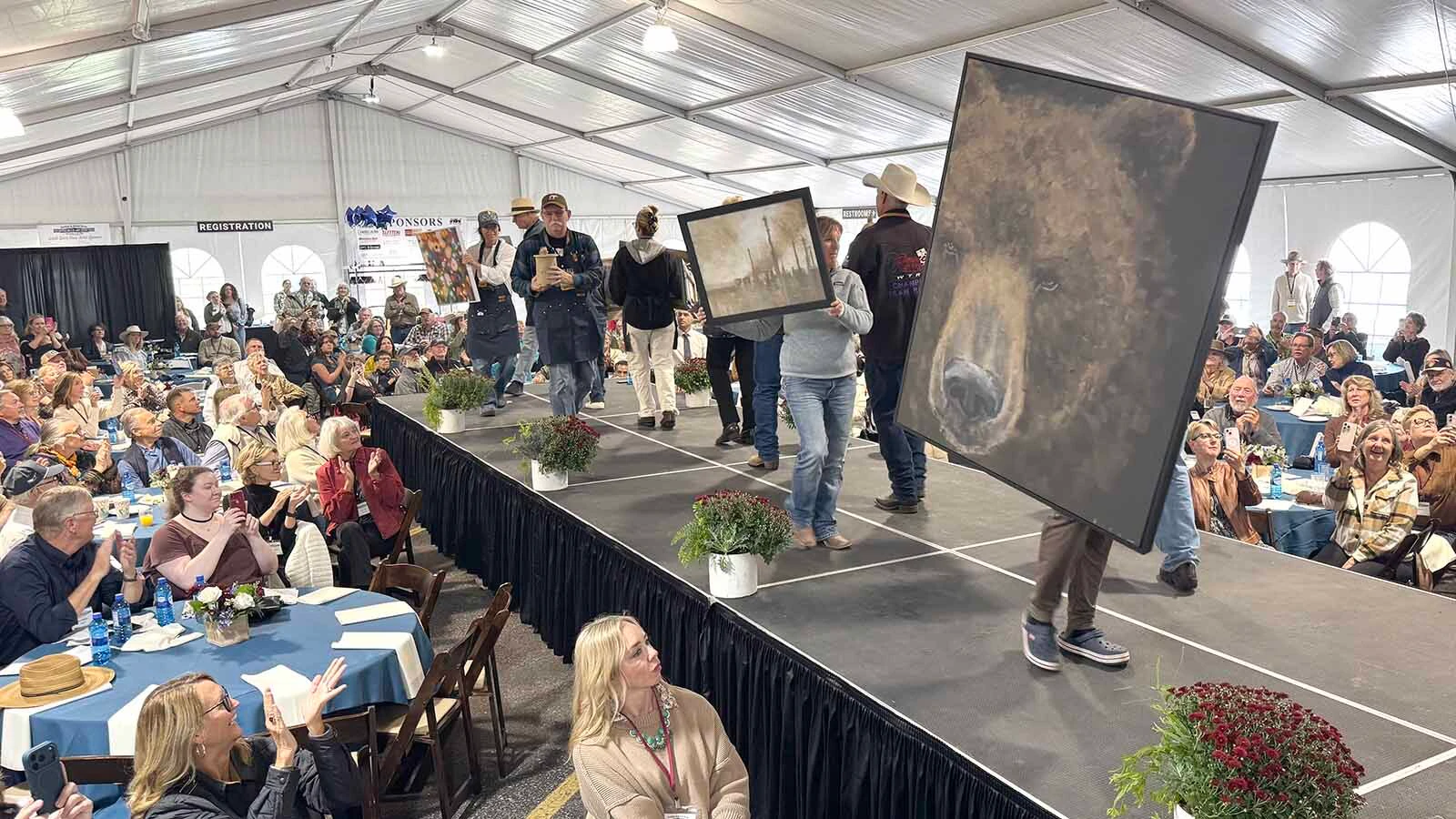 Artists make their way down the runway during the 45th Buffalo Bill Art Show and Sale's Quick Draw.