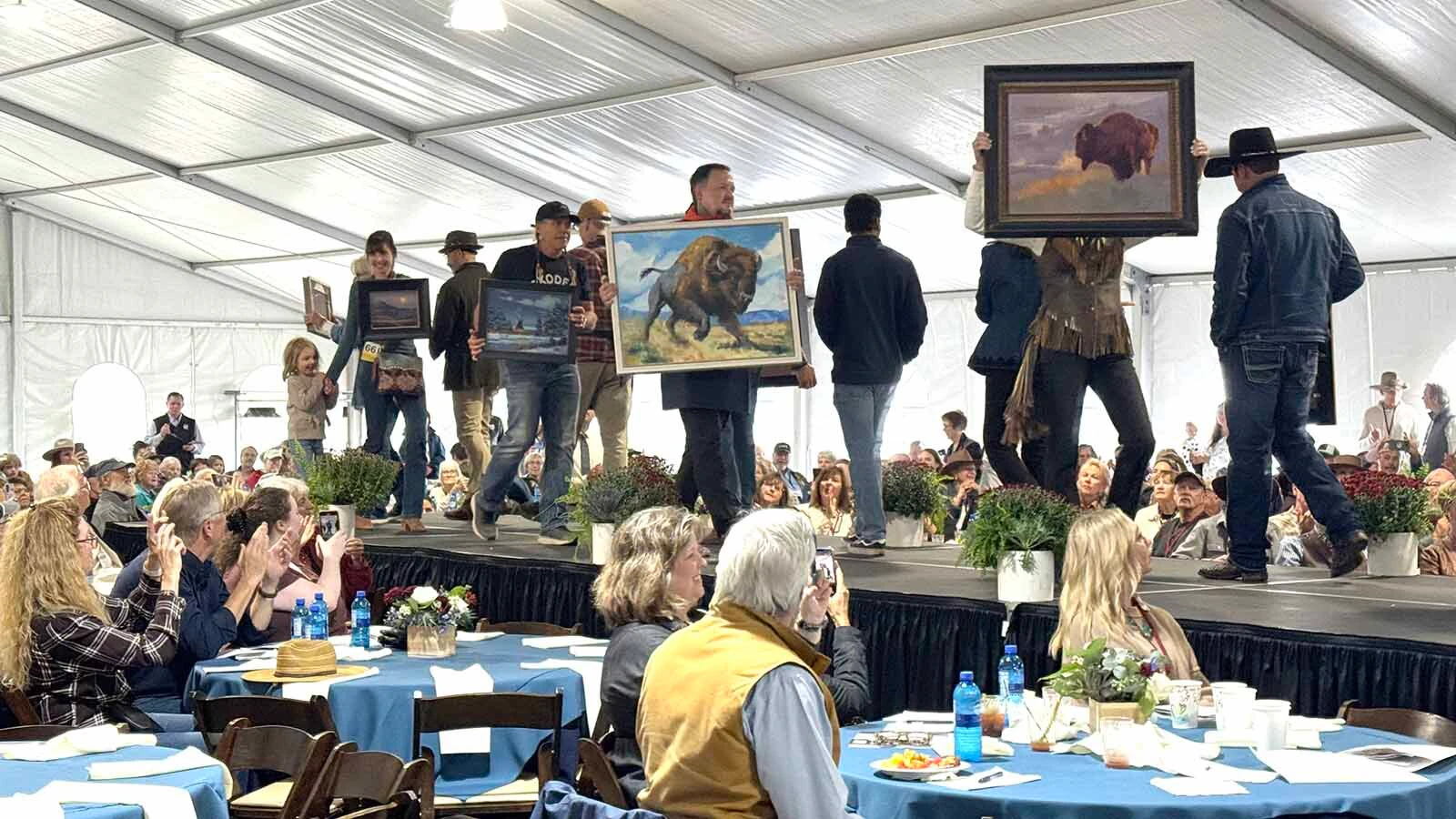 Artists make their way down the runway during the 45th Buffalo Bill Art Show and Sale's Quick Draw.