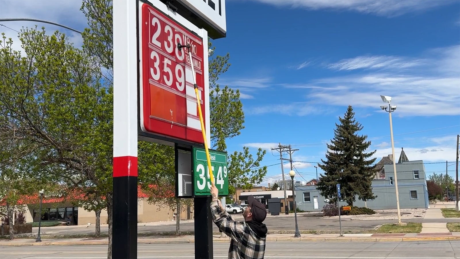 Hi Market co-manager CJ Allison changes the price of unleaded gas from $3.34 a gallon to $2.38 a gallon on Saturday.