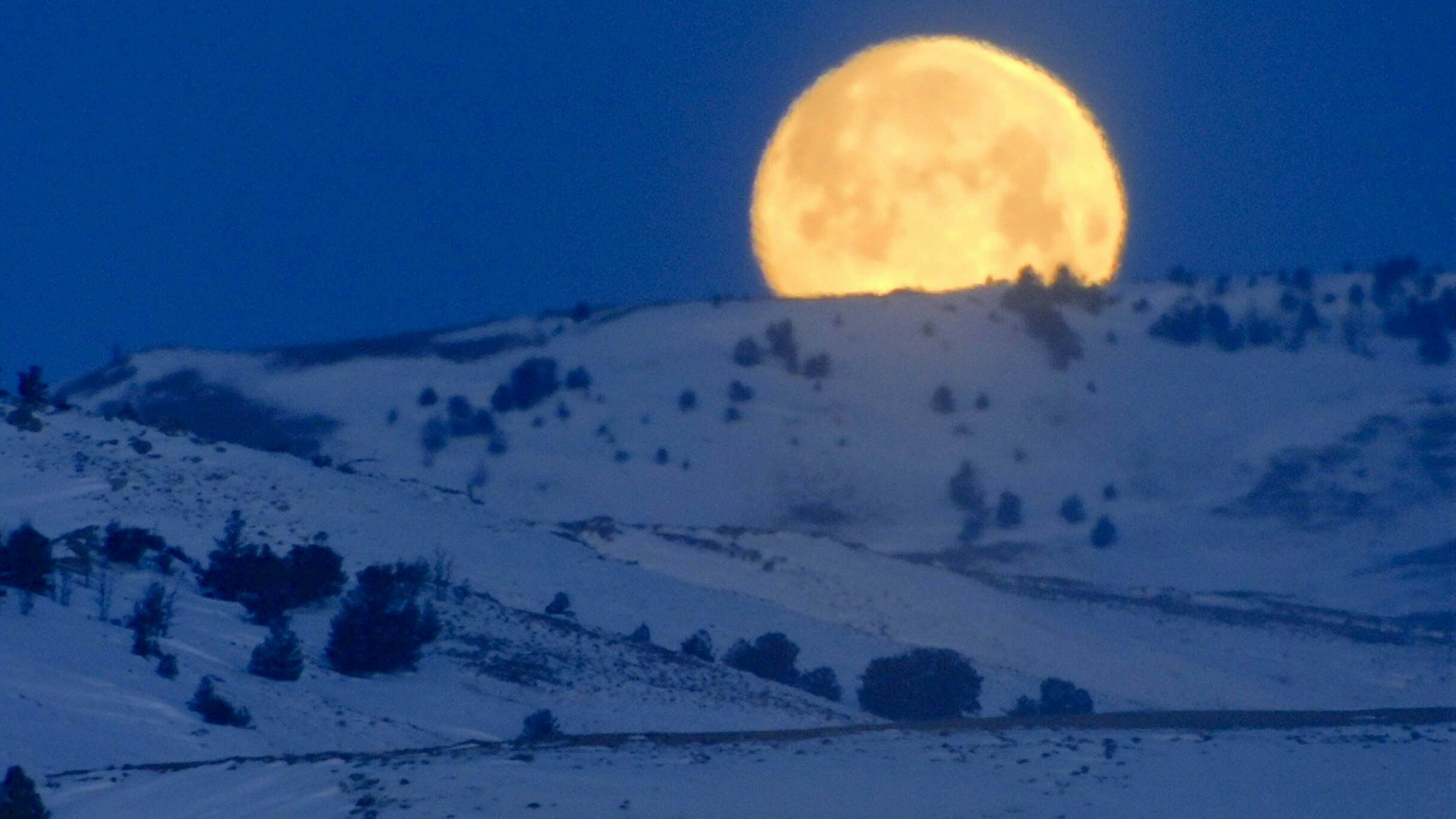 Photo of rising moon taken along Tebra Morris' mail route.