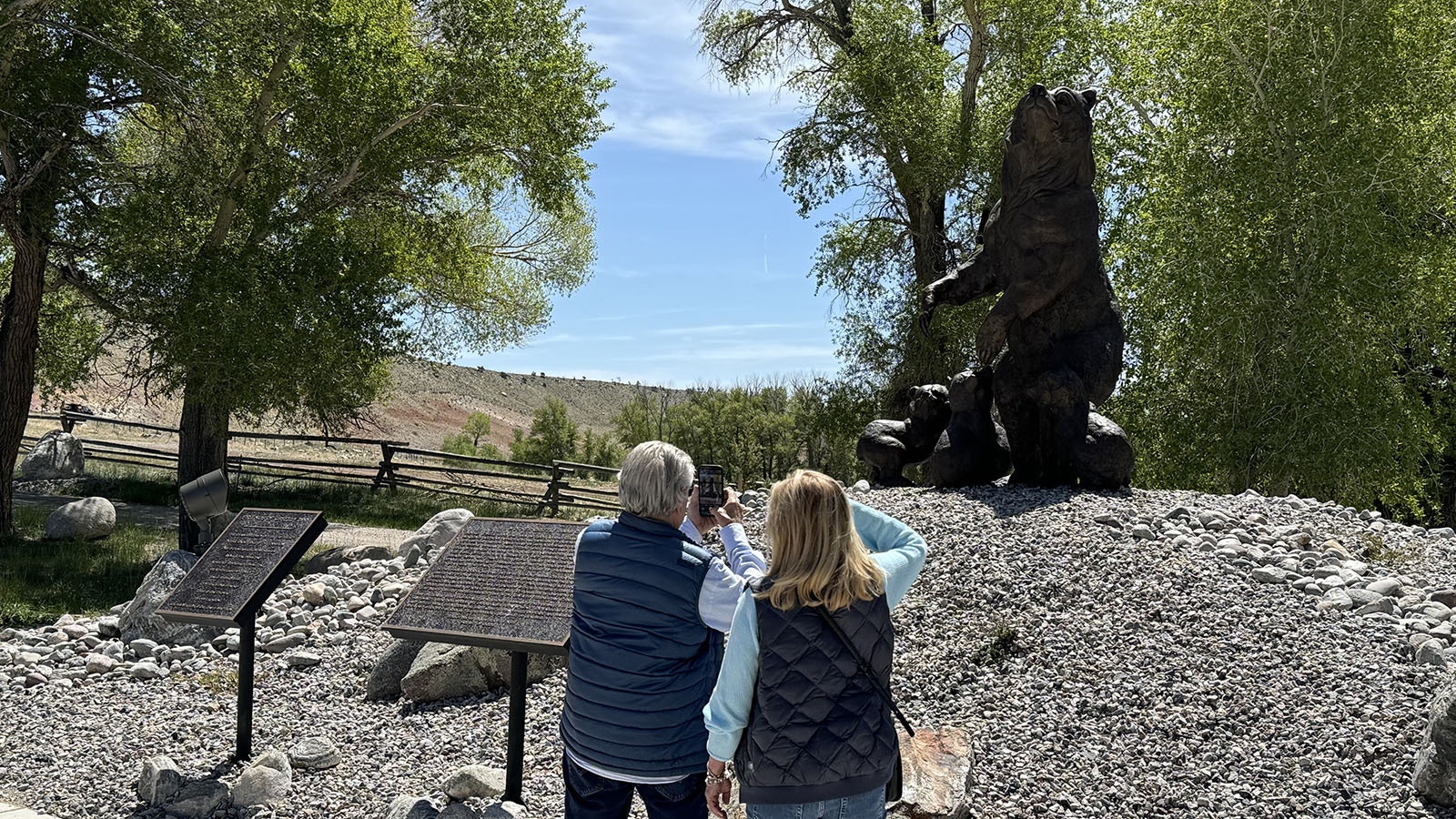 Visitors admire the bronze sculpture of Grizzly 399 and her four cubs in Dubois. The sculpture was funded by the Grizzly 399 Project, an initiative of the Deidre Bainbridge Wildlife Fund.
