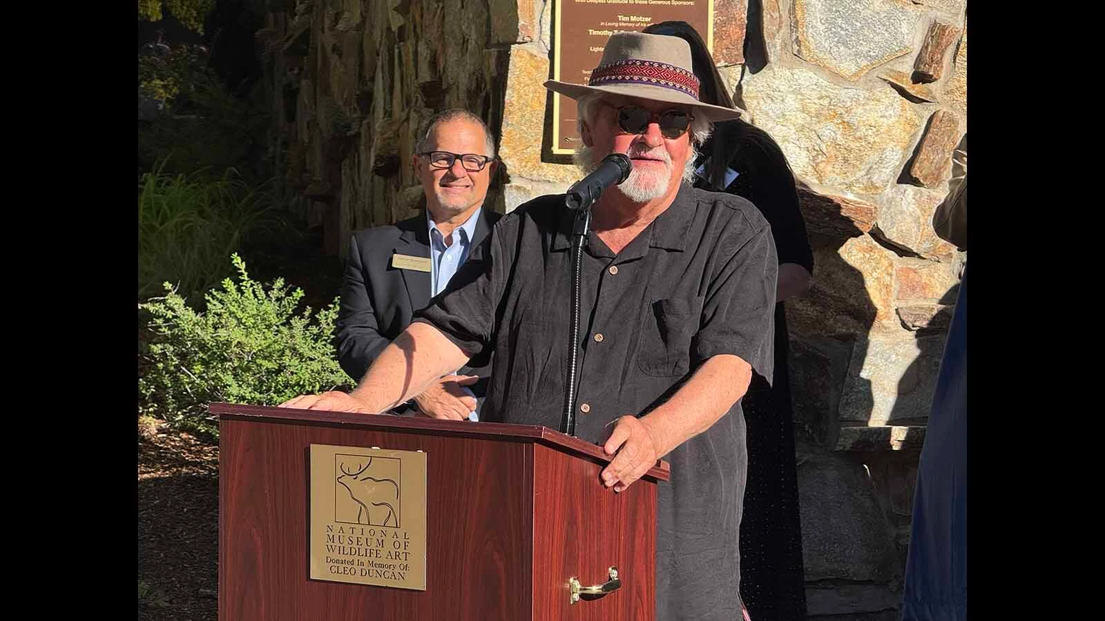Jackson resident and wildlife photographer Tom Mangelson speaks at the unveiling of "Against All Odds: Grizzly 399" at the National Museum of Wildlife Art.