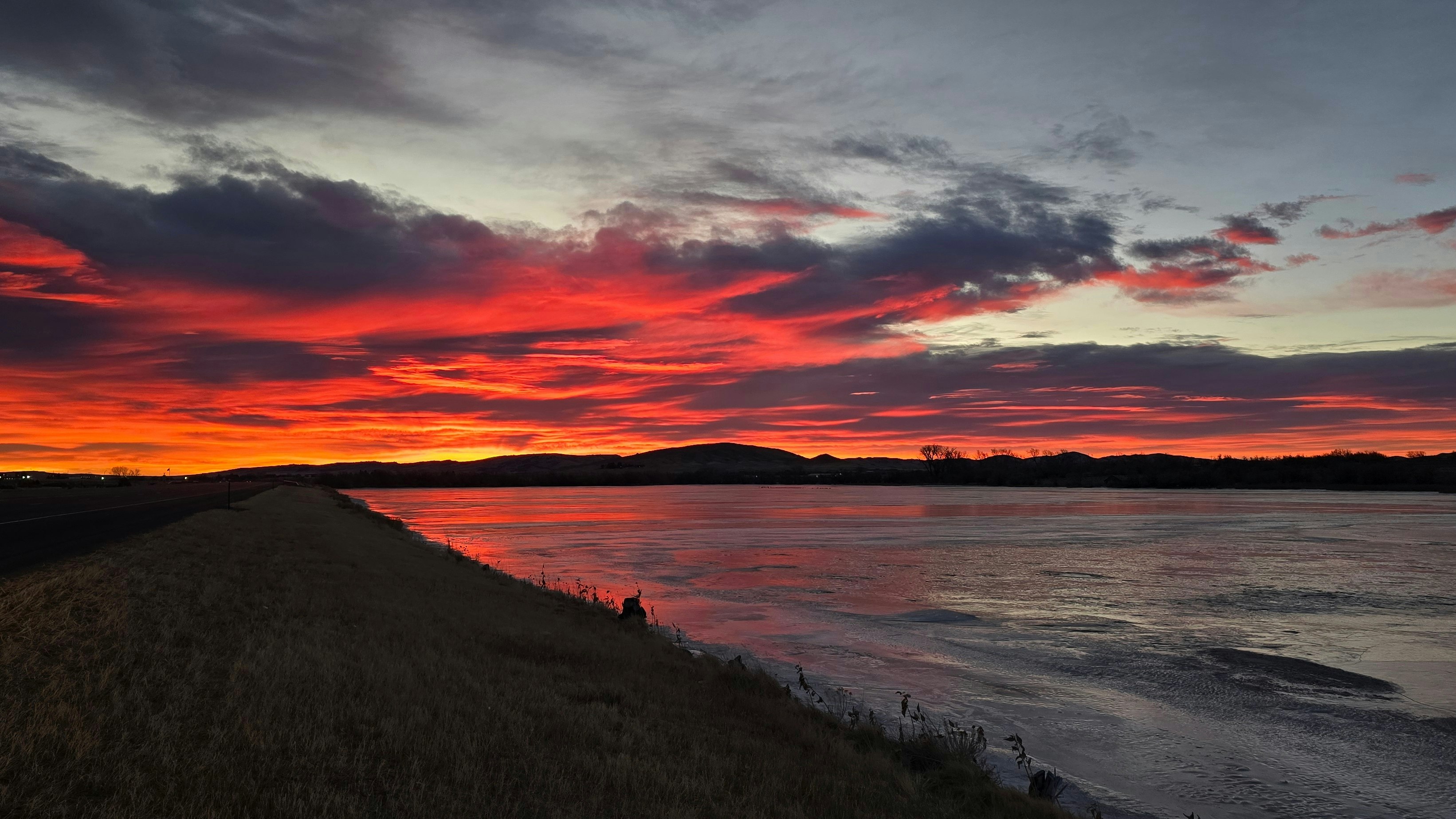 "Sunrise over a frozen Beck Lake." Cody, WY
