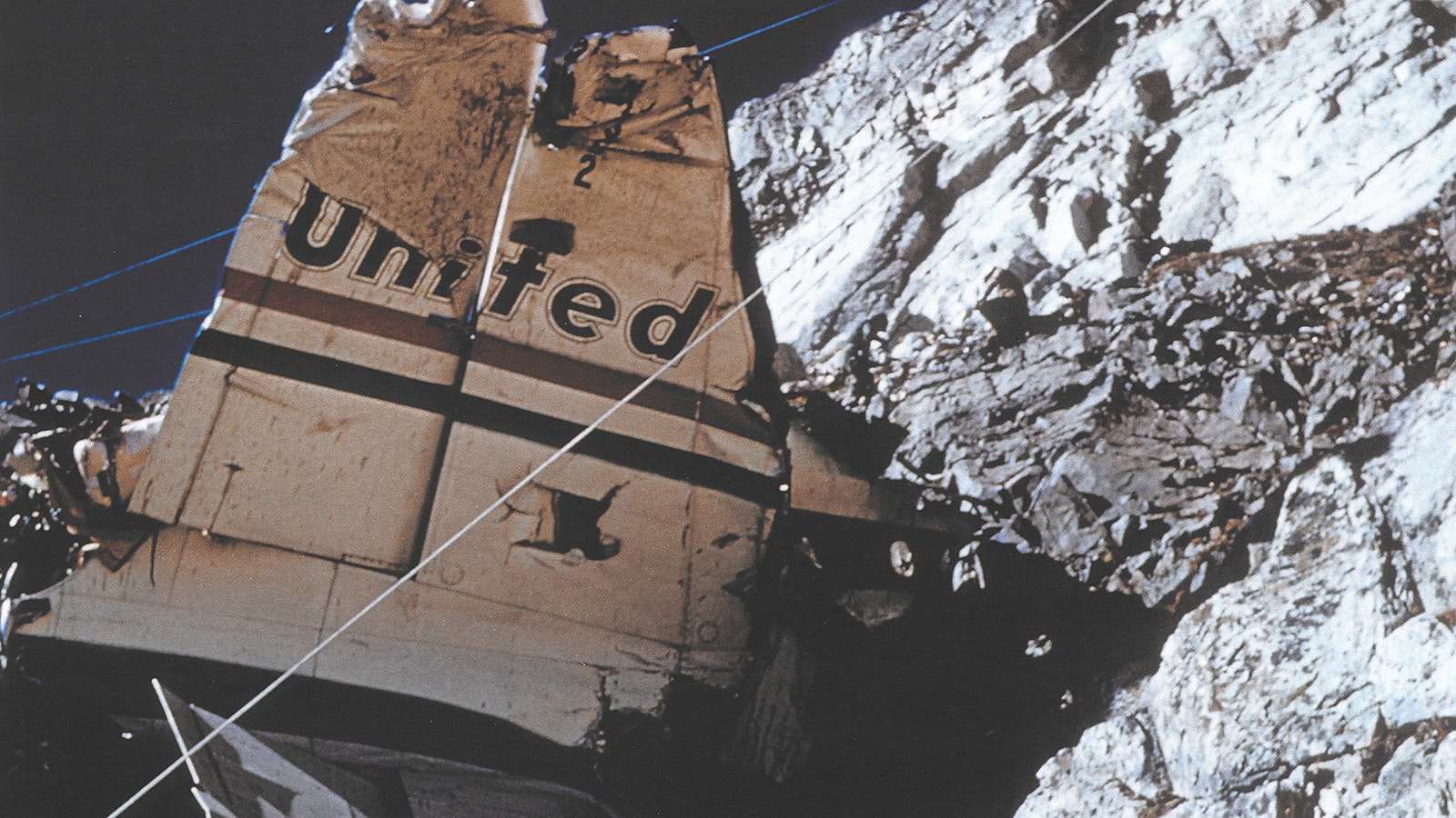 This photo of the United Airlines Flight 409 tail section on Medicine Bow  Peak was taken by Robert Harrower with a camera he found at the crash site.