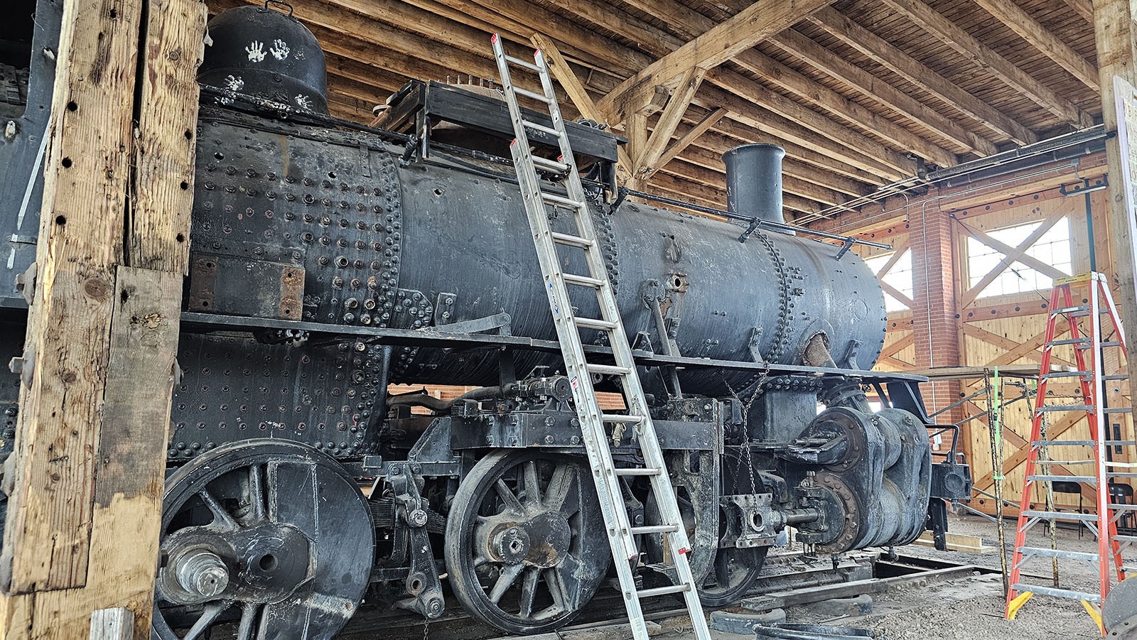 A ladder is used to climb up to the top of 4420 during restoration efforts.