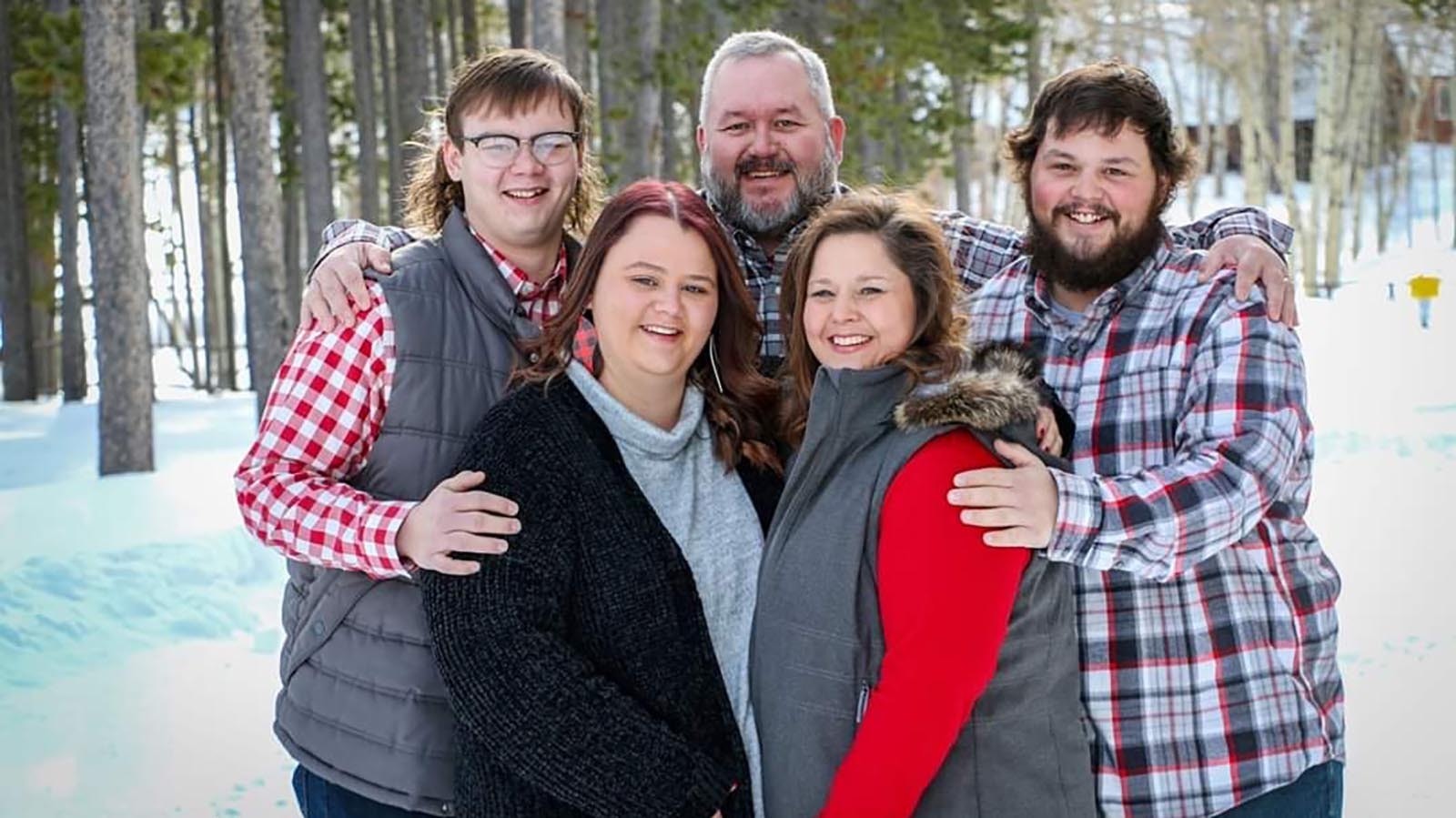 Buddy Clancy, back center, says he believes that if someone close to his son Kohlman, right, had called 911 when he suffered a medical emergency, Kohlman would still be alive.