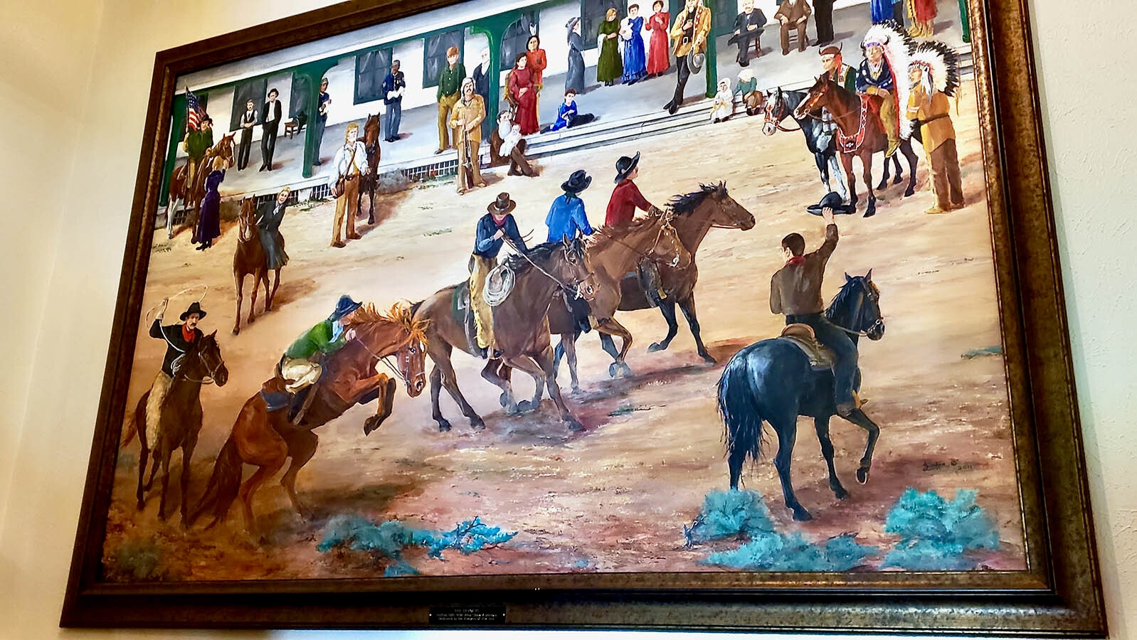 A painting depicts the scene at the Sheridan Inn when Buffalo Bill Cody managed it.