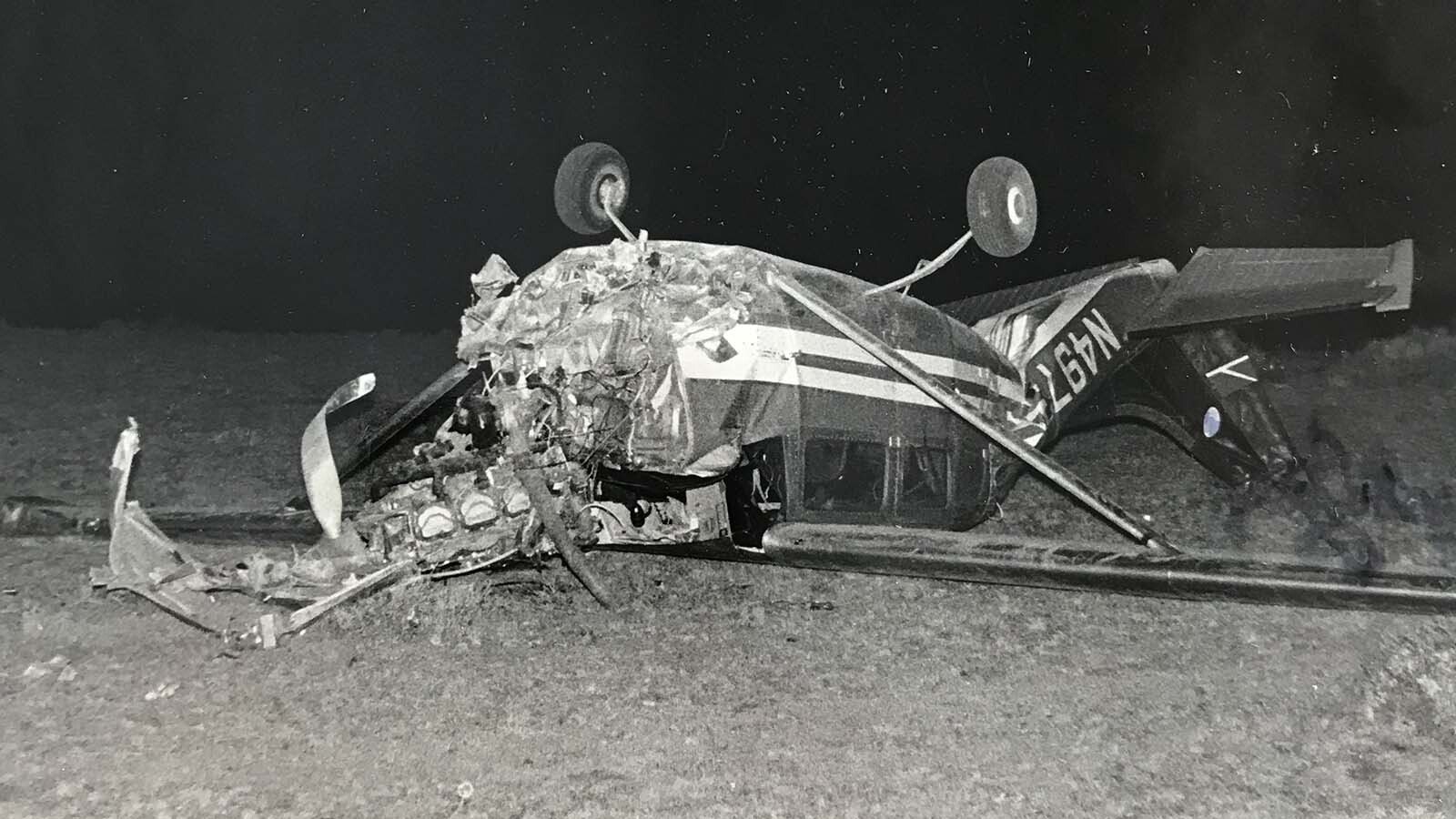 The wreckage of the Cessna 206 shows the extent of the damage to the front of the aircraft.