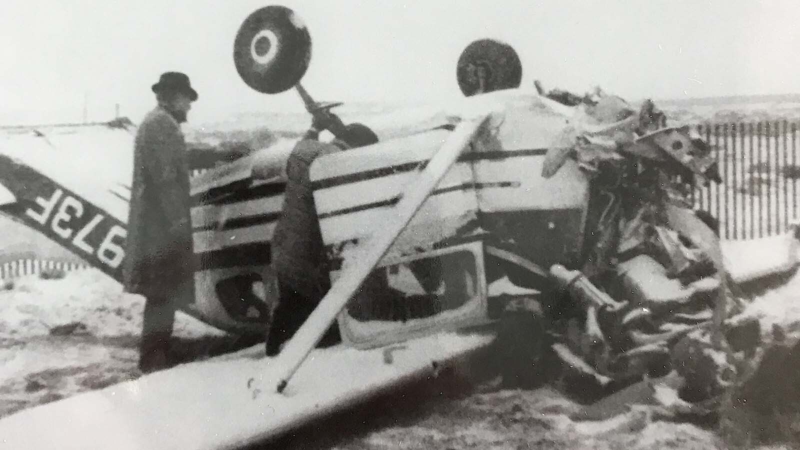 A man inspects the crashed Cessna following James Barrett’s crash near Rawlins in 1969.