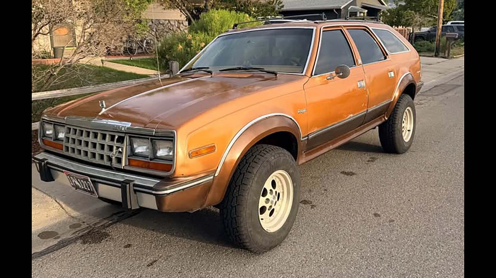 Austin Griess' lifted 1984 AMC Eagle sits on a Wyoming backroad. The four-wheel-drive wagon is the perfect Bigfoot-hunting rig.