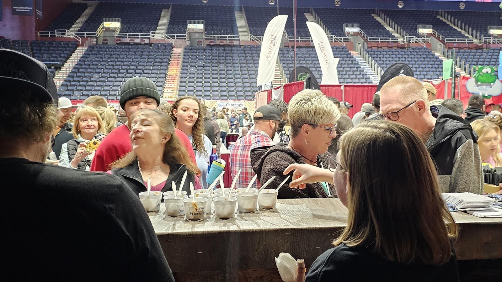 A crowd lined up to try a Texas-style red chili at the Industrial Screen and Maintenance during the API Chili Cook-Off in Casper.