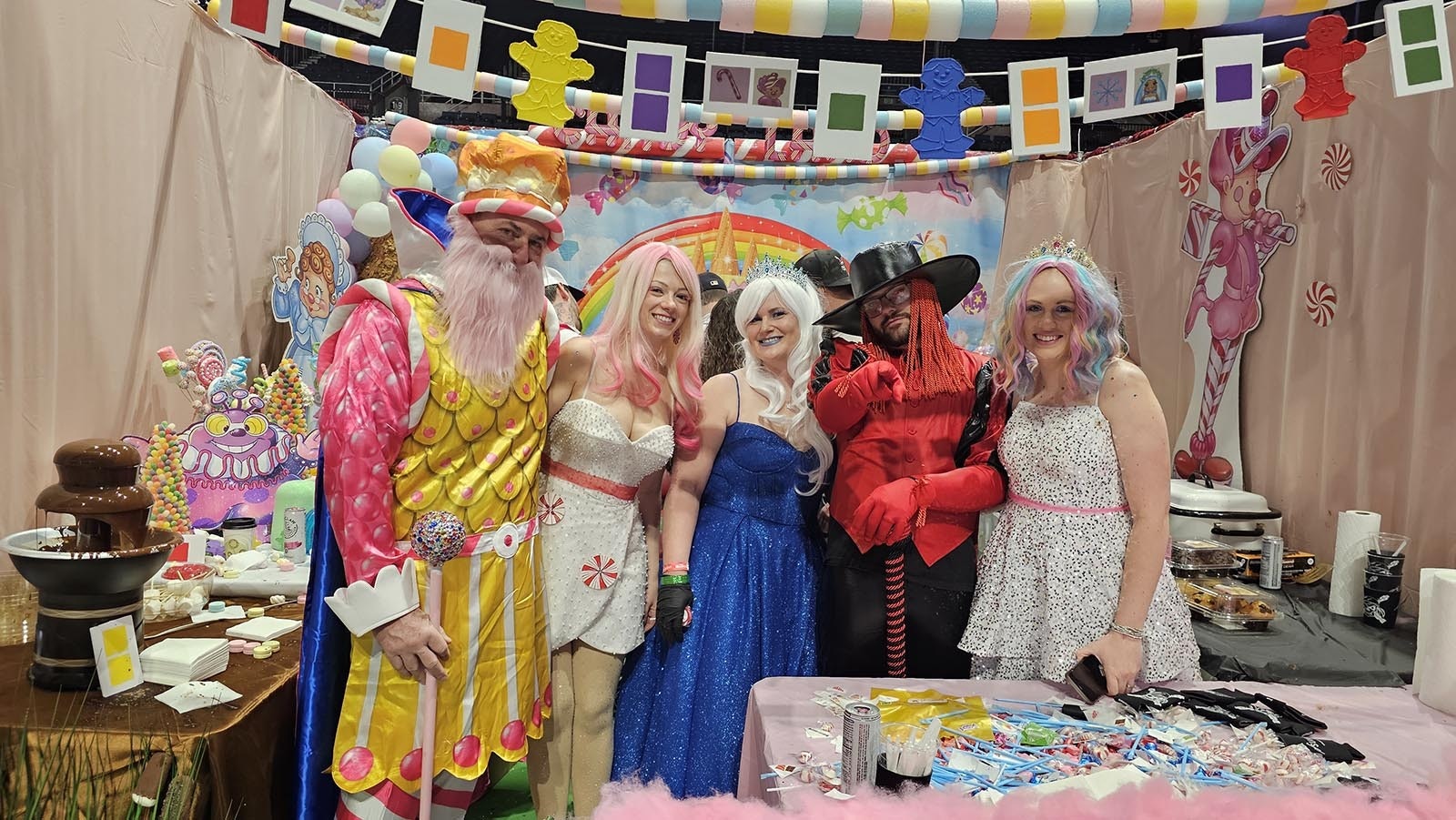 King Candy (John Keeler), Miss Mint (Erin Desjarlais), Queen Frostine (Stacey Sapp), Lord Licorice (Josh Wolfe), and Princess Lolly (Bobby McCauley) pose at ESP Summit's Candy Land booth during the API Chili in Casper. The booth took volunteers two months to build, and was a huge hit, offering chocolate covered marshmallows for chili-weary tastebuds.