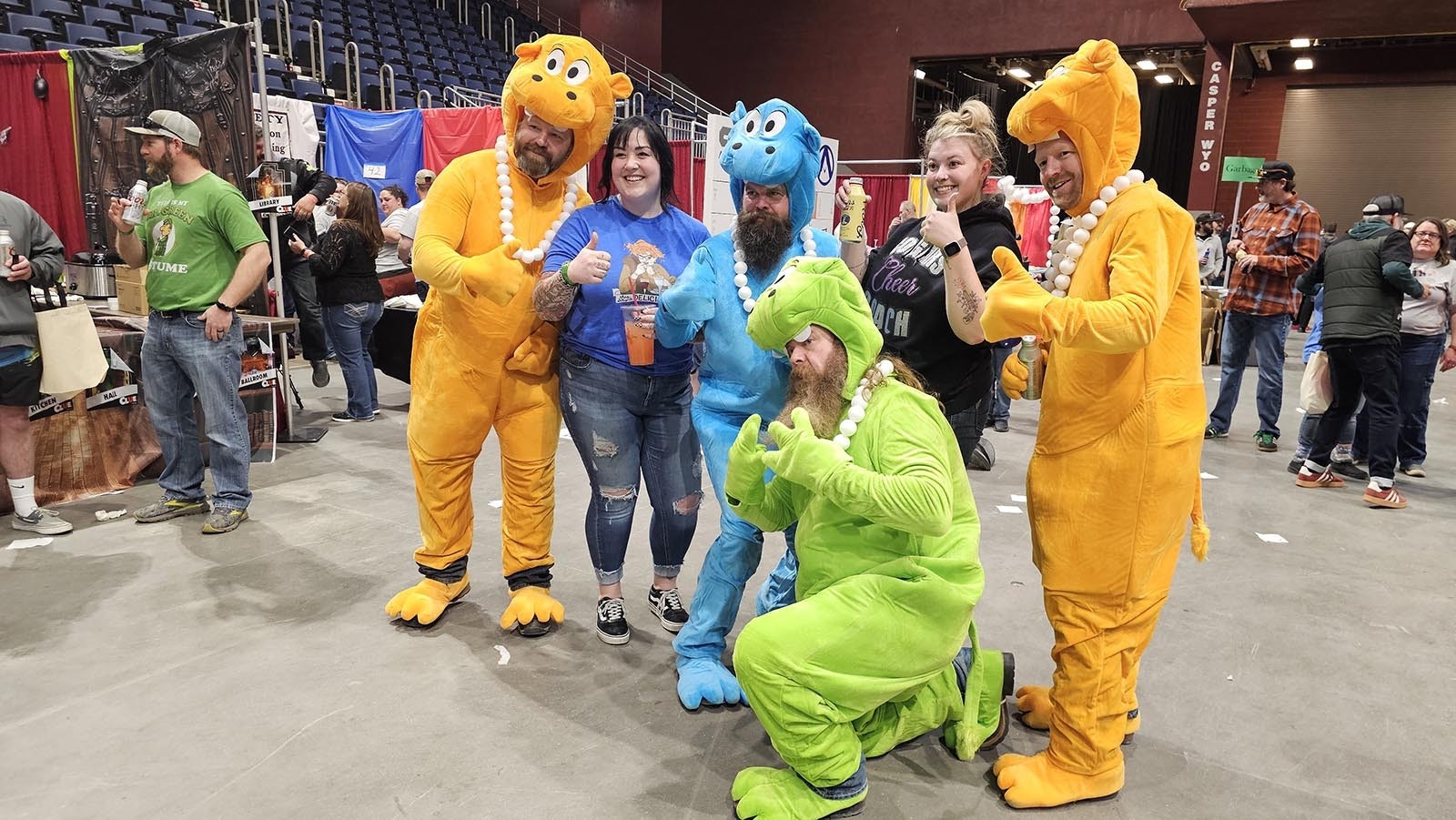 From left, Joe Ritz, John Ilharreguy, Mike Miller, and Jarrett Wilson, quality control personnel for Granite Peak, take a selfie with a couple of API Chili Cook-Off goers Saturday in Casper. The costumes were a win for the company, as far as networking goes, starting lots of conversation during the event.