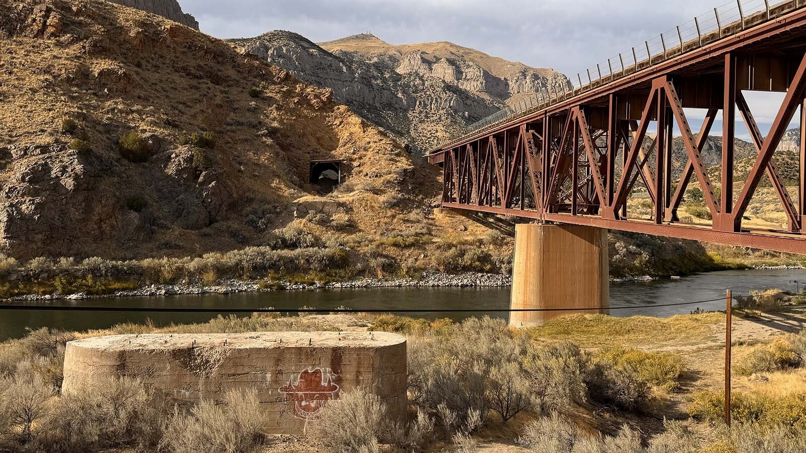 Abandoned tunnel in the Boysen State Park that the railroad refused to build higher. This resulted in decades of court battles against Asmus Boysen to demolish his dam in the Wind River Canyon. It's now crumbling.