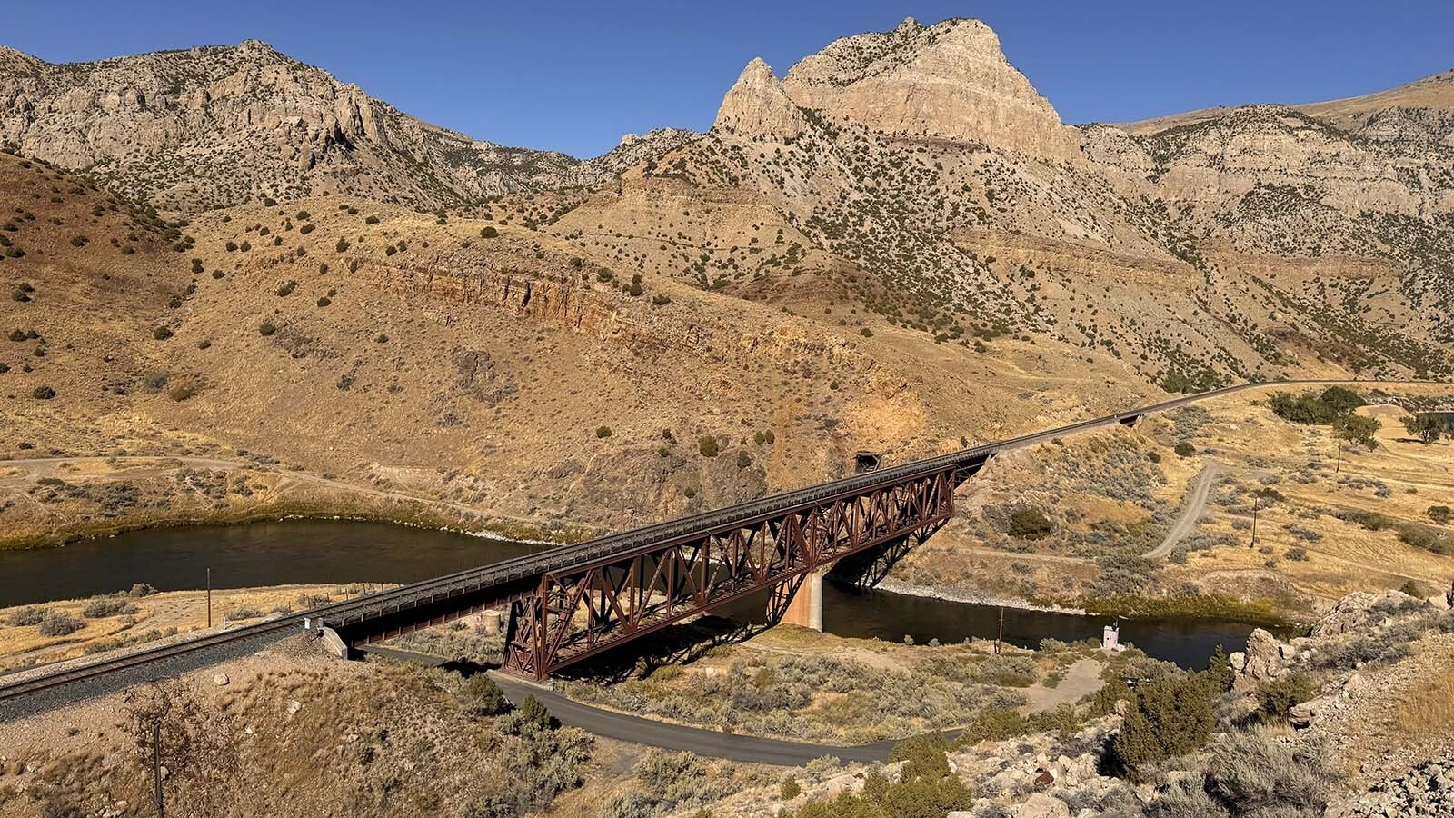 Abandoned tunnel in the Boysen State Park that the railroad refused to build higher. This resulted in decades of court battles against Asmus Boysen to demolish his dam in the Wind River Canyon. It's now crumbling.