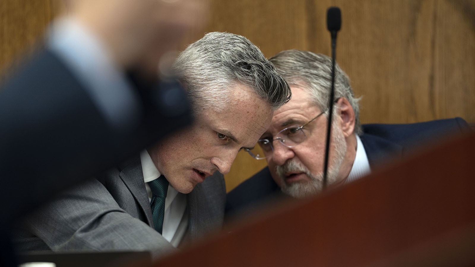Attorneys Tim Garrison and Frederick Harrison talk during a hearing Friday in Teton County District Court while representing parties requesting to become part of cases defending Wyoming's bans on abortions.
