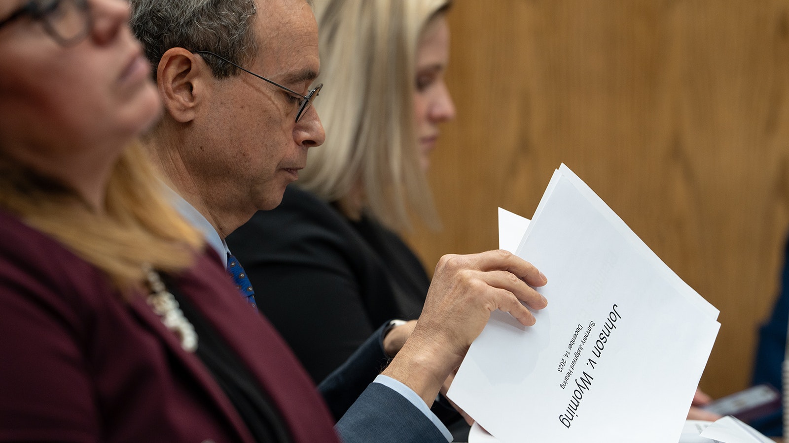 Plaintiffs’ attorney Peter Modlin looks through the printout of his PowerPoint presentation a summary judgment hearing Thursday in Teton County District Court.