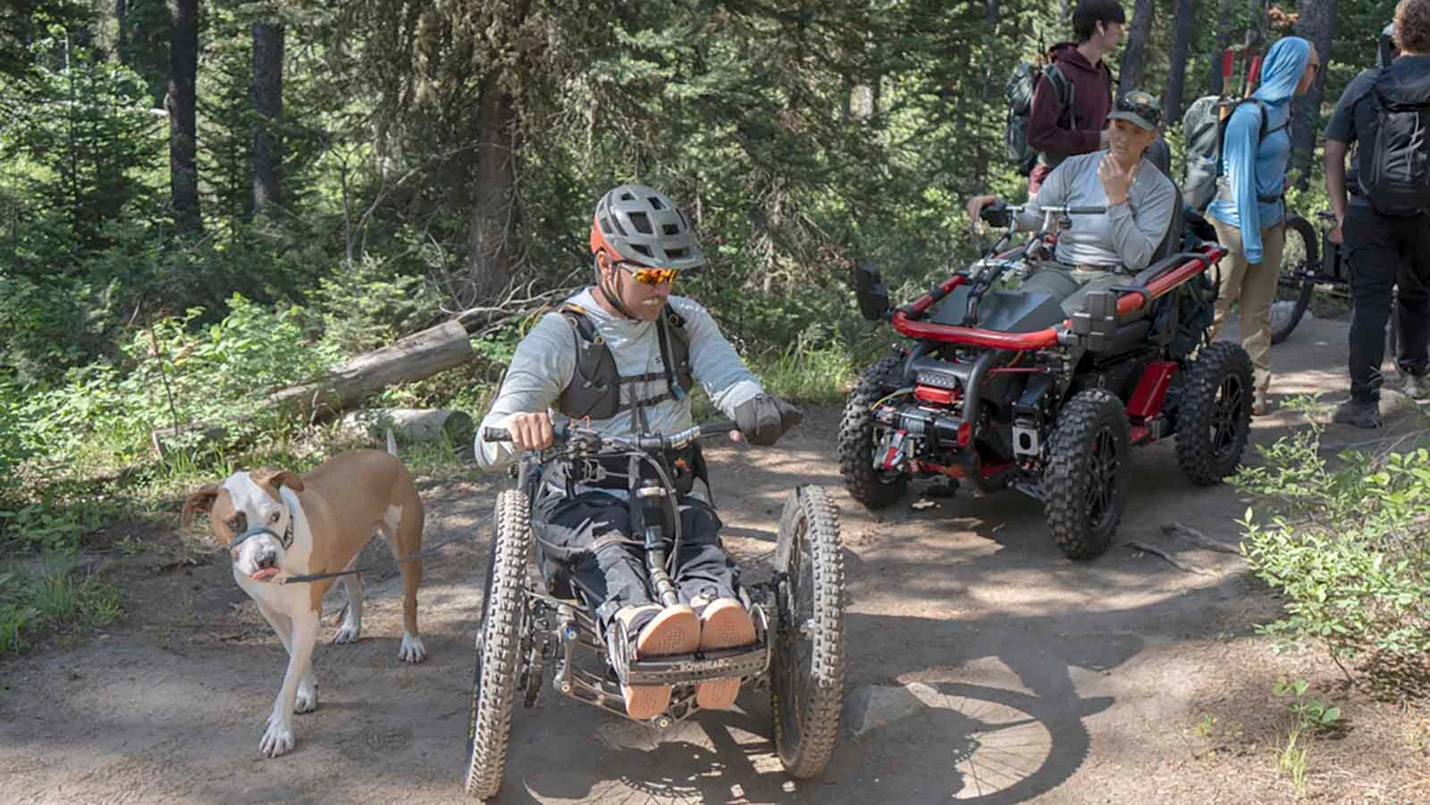 Joe Stone and his dog George demonstrate use of adaptive equipment.