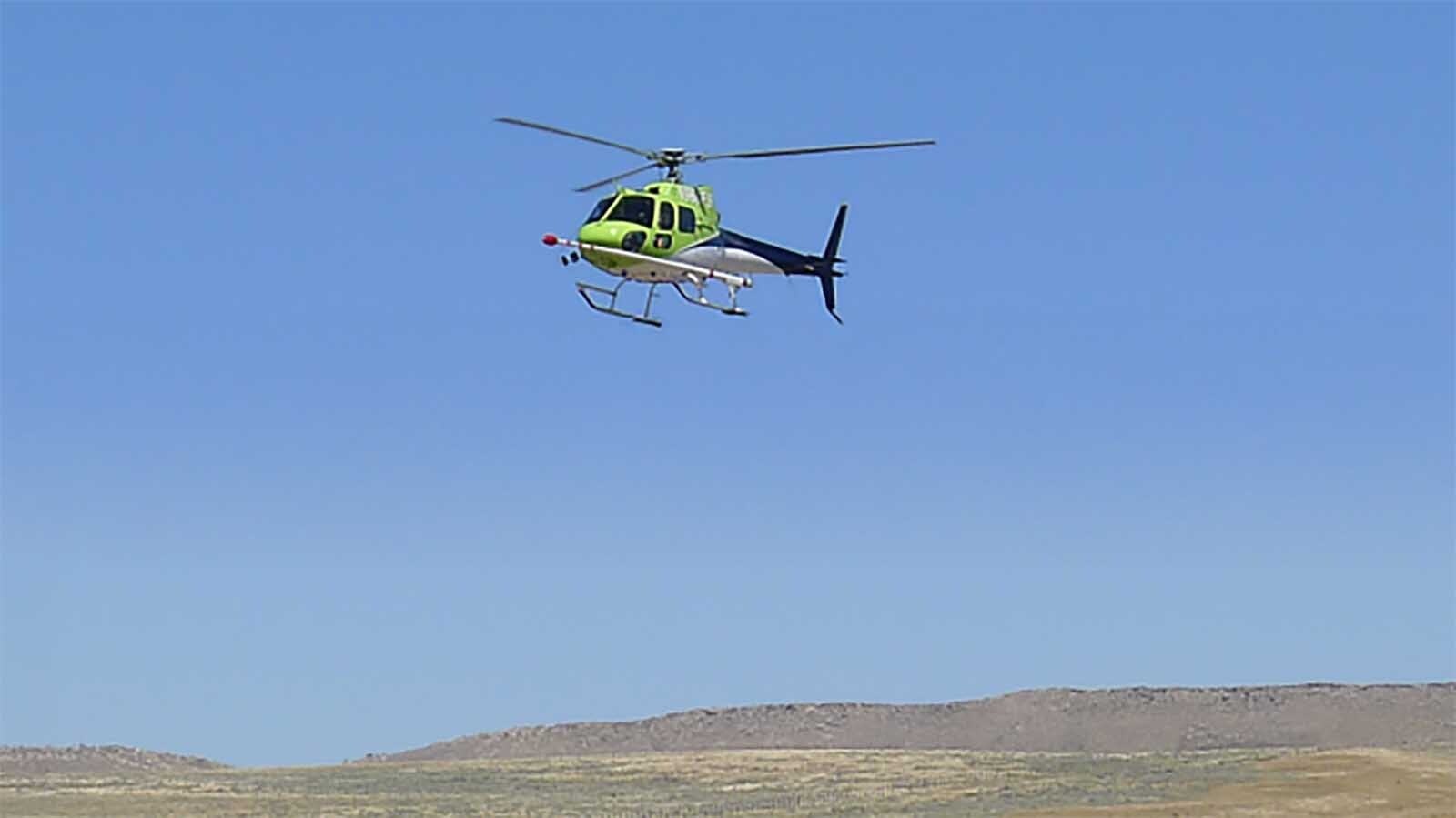 The recently announced survey for northeast Wyoming will use fixed-wing aircraft, but in other parts of Wyoming, the USGS uses helicopters outfitted with stingers, like these in Rawlins.