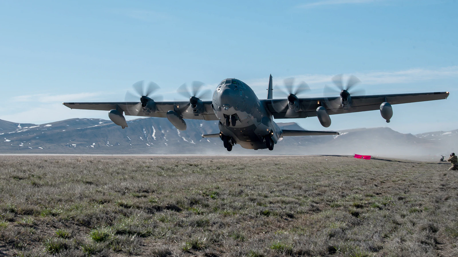 An MC-130J Commando II from the 1st Special Operations Wing takes off from Highway 287 in Wyoming during Exercise Agile Chariot on April 30, 2023, honing capabilities linked to Agile Combat Employment. Instead of relying on large, fixed bases and infrastructure, ACE employs smaller, more dispersed locations and teams to rapidly move aircraft, pilots and other personnel as needed. Under ACE, millions of miles of public roads can serve as functional runways with Forward Arming and Refueling Points when necessary.