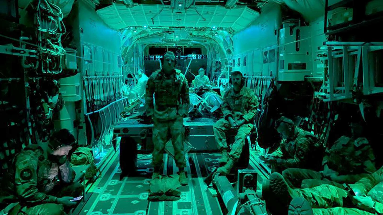 Master Sgt. Joshua Eby, aircraft armament technician, and Master Sgt. Jeremy Mosley, electrical and environmental craftsman, both members of the 127th Aircraft Maintenance Squadron and "ACE" team, travel via MC-130J Commando II to a Wyoming highway as part of Exercise Agile Chariot, Apr. 30, 2023. The Selfridge Air National Guard-based team of Citizen-Airmen were invited by AFSOC to participate in exercise Agile Chariot, a training event that was historical, in part, due to the number and type of aircraft involved. The ACE team supported landings and takeoffs of the MC-130J, MQ-9 Reaper and two of their own A-10 Thunderbolt II aircraft on Wyoming Highway 287.