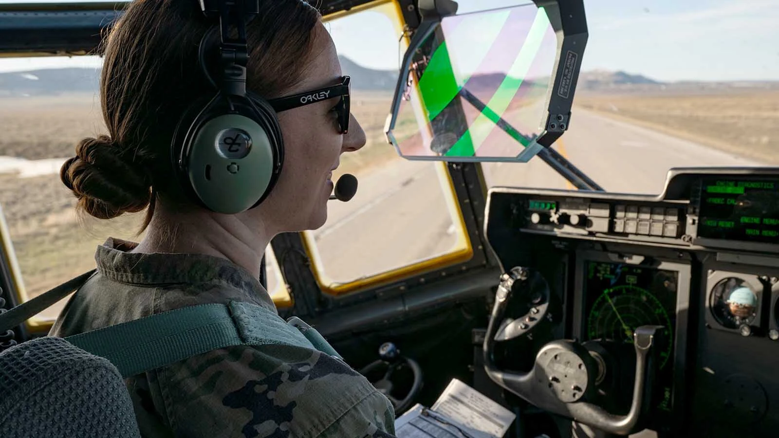 U.S. Air Force Capt. Katheryn Richardson, an aircraft commander assigned to the 15th Special Operations Squadron, smiles after landing an MC-130J Commando II on U.S. Highway 287 during Exercise Agile Chariot, near Rawlins, Wyoming, April 30, 2023. Agile Chariot tested Agile Combat Employment capabilities, including using smaller, more dispersed locations and teams to rapidly move and support aircraft, pilots, and other personnel to wherever they are needed.