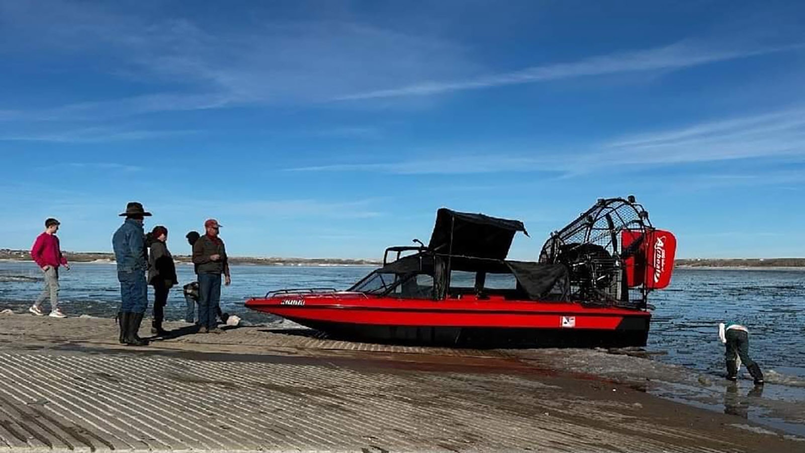 The airboat on a lake shore before the snow started flying in Wyoming.