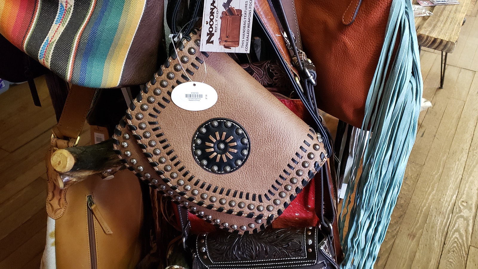 A conceal-carry purse made of leather.