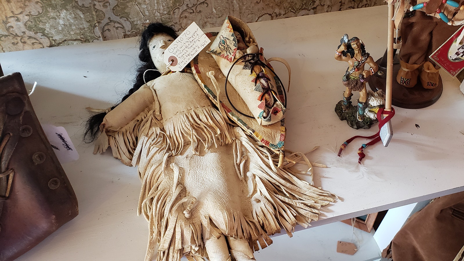 A doll on cradle board signed for sale in the Aladdin General Store.