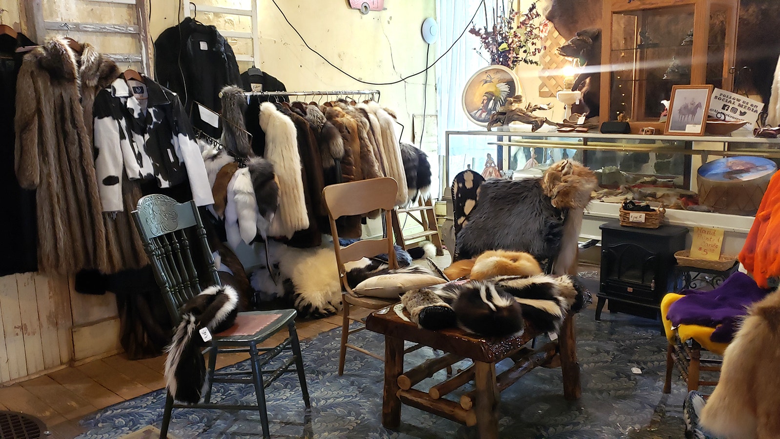 A rack of fur coats including mink and fox are for sale in the Aladdin General Store.
