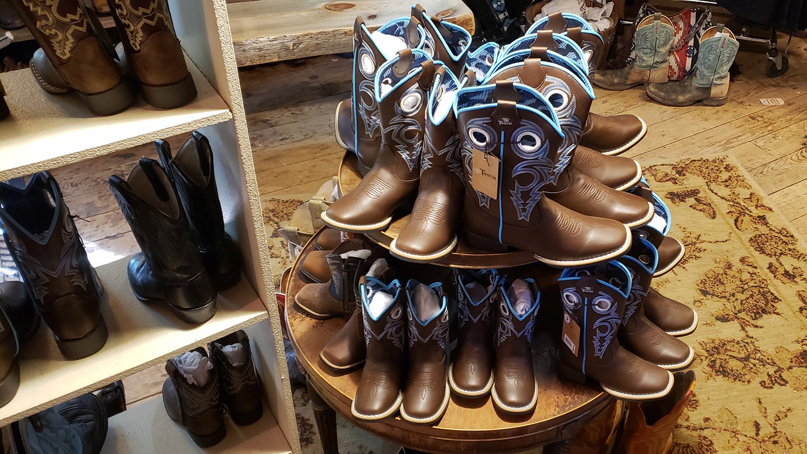 A range of cowboy boots are for sale in the Aladdin General Store.