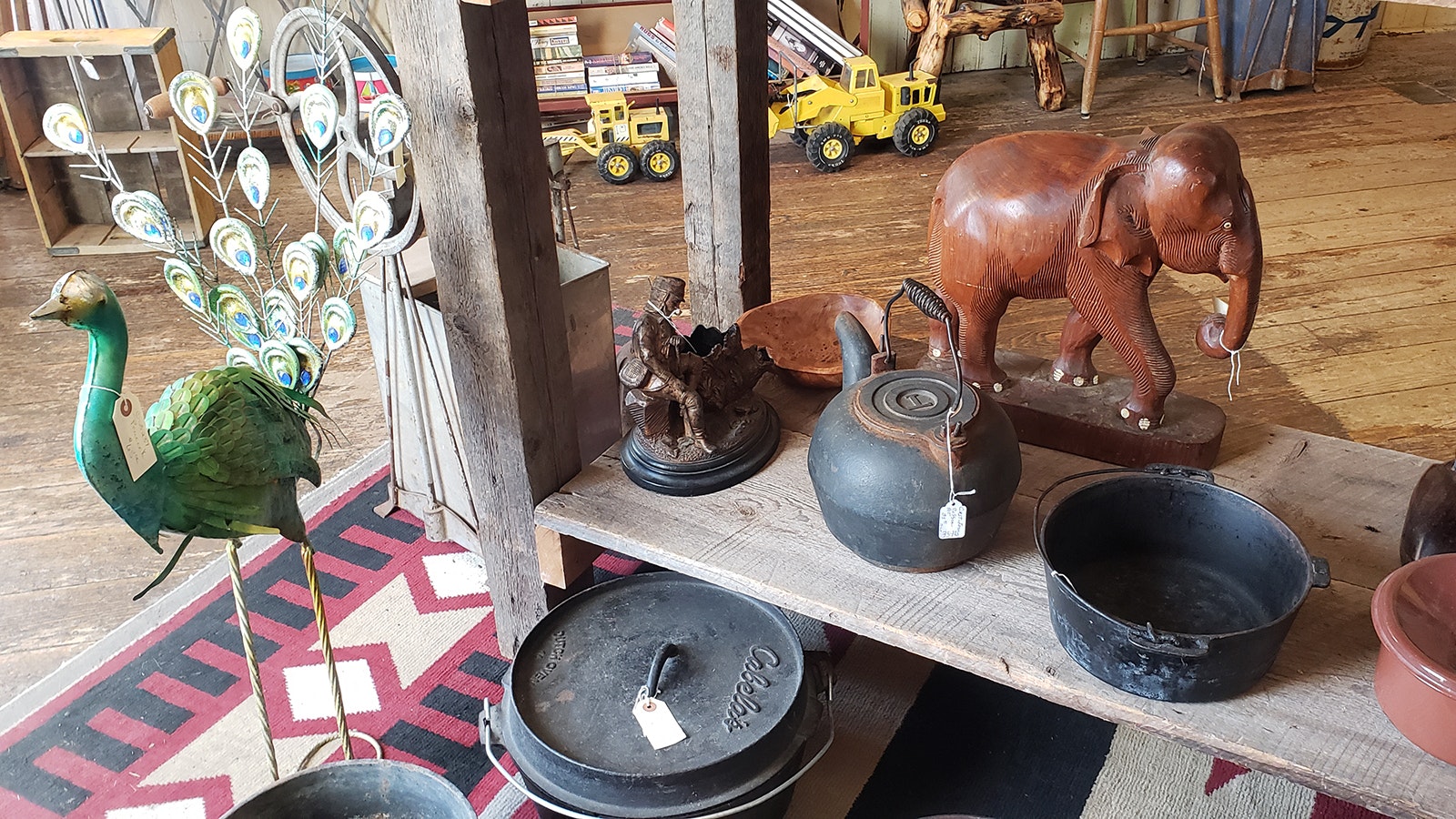 Antique cast iron pans on selves with sculptures and Tonka toys all contribute to the museum-esque feel of the Aladdin General Store. But unlike a museum, all the items are for sale.