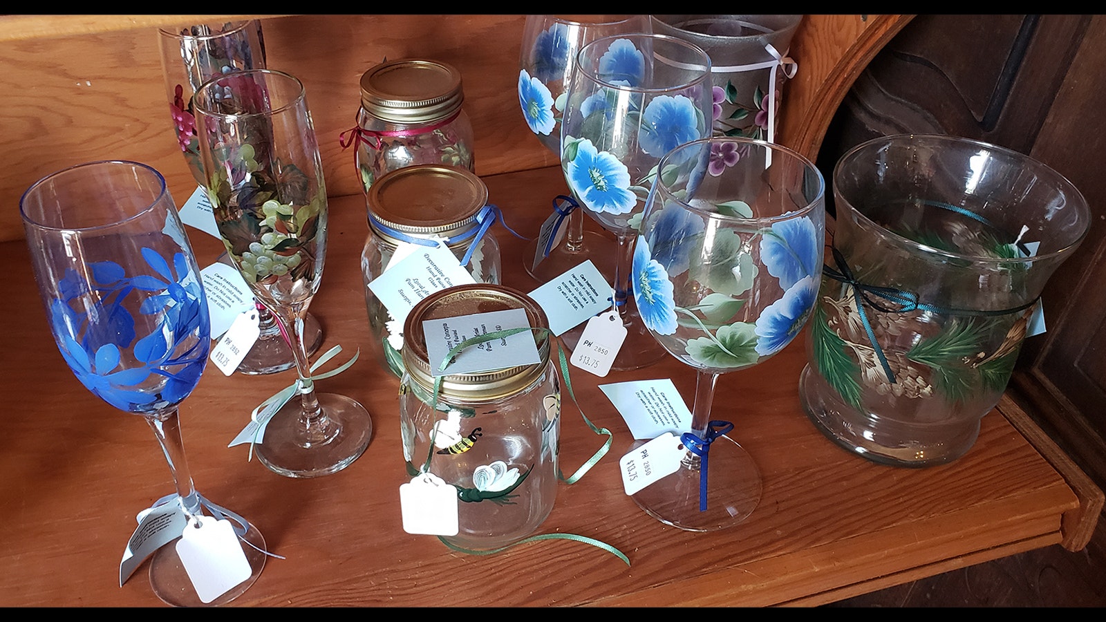 Painted wine glasses are among the hand-crafted merchandise available at the Aladdin General Store.