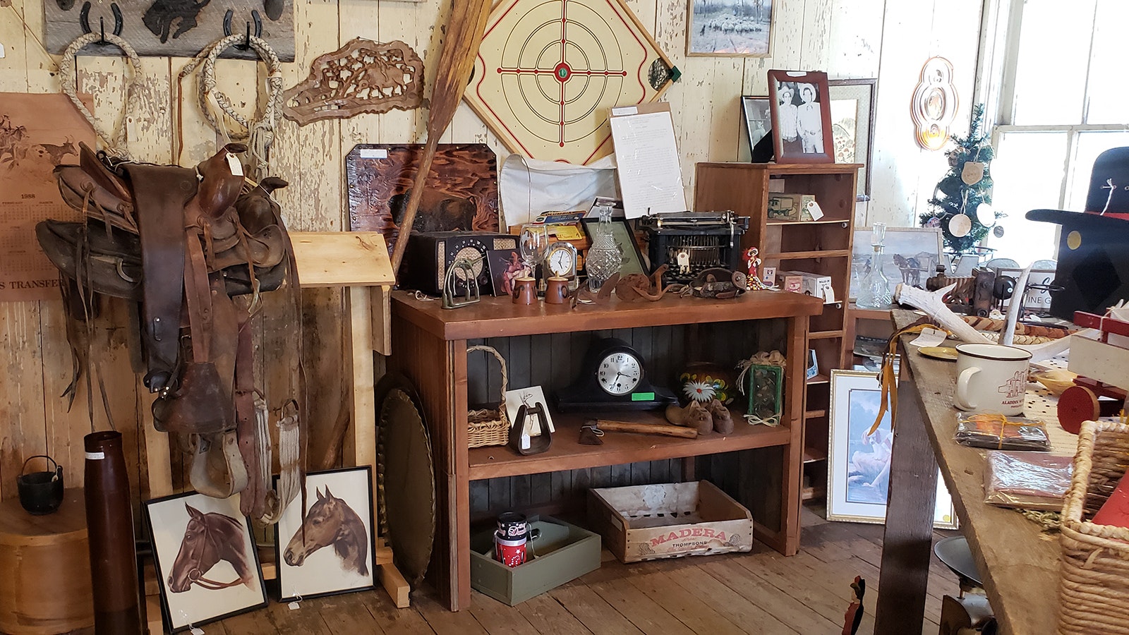 Saddles, pictures of horses, time pieces and more for sale at the Aladdin General Store.