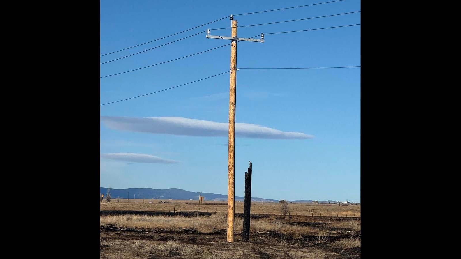A 56-acre grass fire that ignited near multiple Laramie gas stations Monday is believed to have originated from I-80, officials believe. Fire crews are now watching the area to ensure the blaze does not rekindle. 