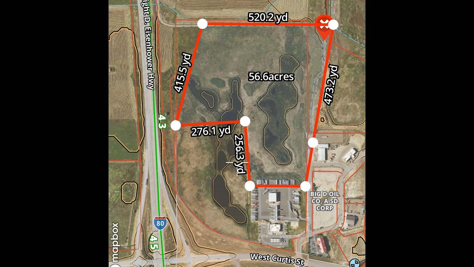 A 56-acre grass fire that ignited near multiple Laramie gas stations Monday is believed to have originated from I-80, officials believe. Fire crews are now watching the area to ensure the blaze does not rekindle. 