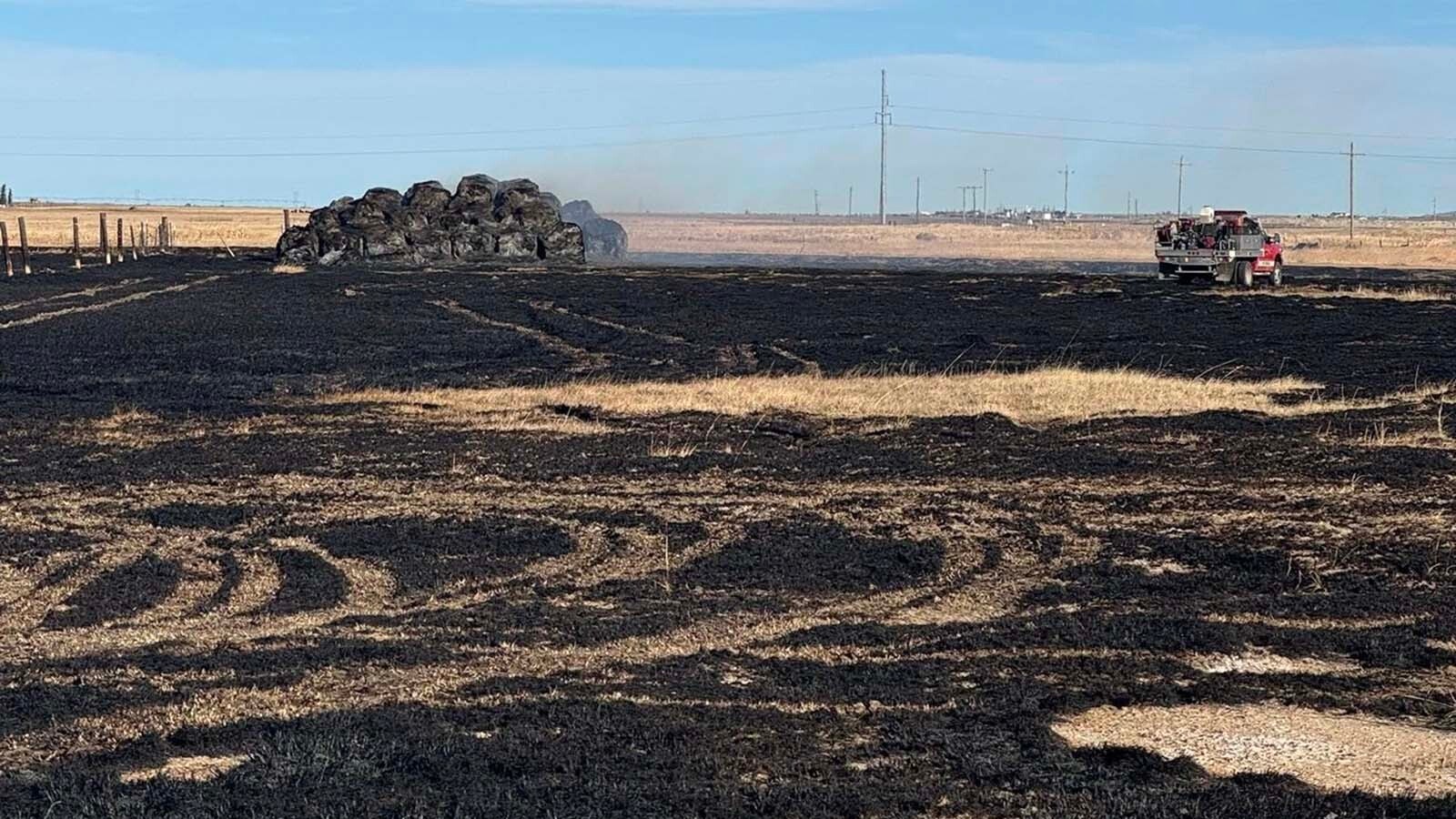 A 56-acre grass fire that ignited near multiple Laramie gas stations Monday is believed to have originated from I-80, officials believe. Fire crews are now watching the area to ensure the blaze does not rekindle. 
