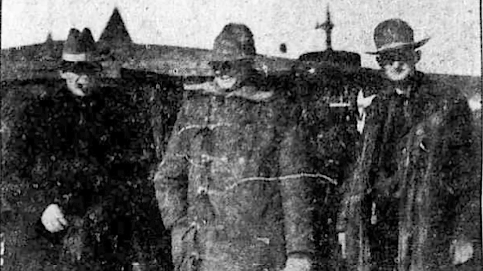 Bert Lampitt, center, flanked by the Hot Springs County sheriff, left, and a deputy.